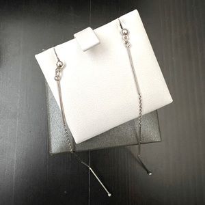 Dainty genuine silver dangle earrings.